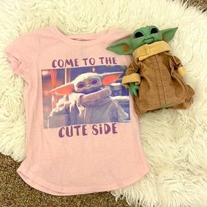 This is a baby yoda  tee. The baby yoda doll is not included.